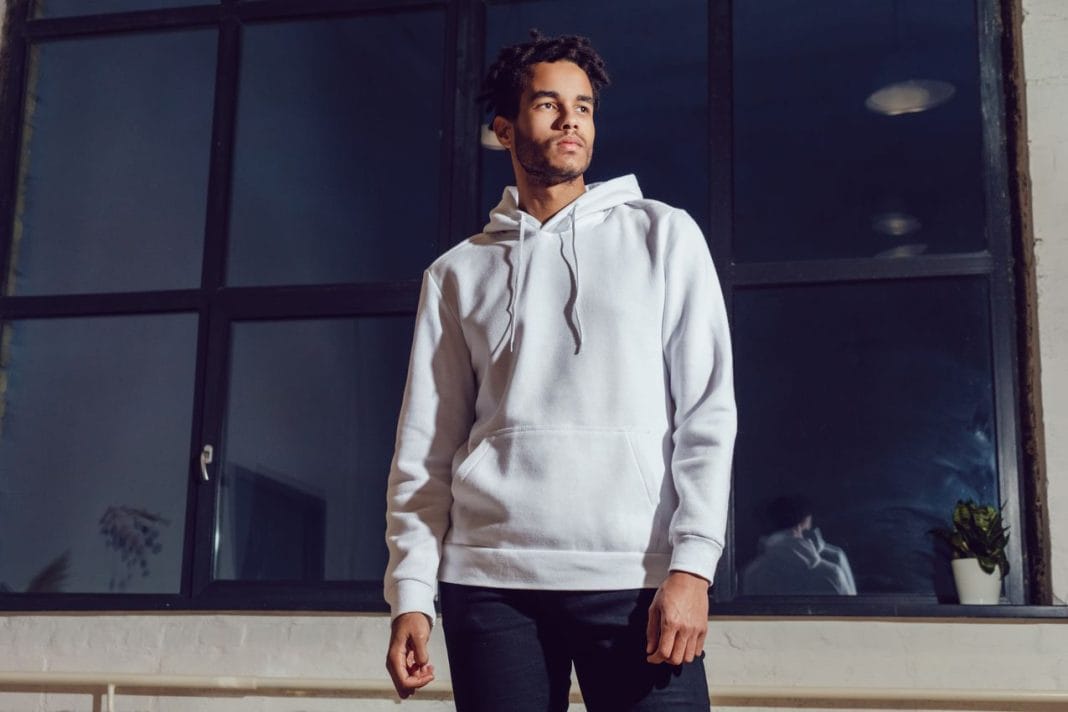 Attractive african american man in hoodie sweater. Mock-up.